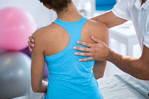 Photo of an athlete getting an examination and adjustment from a Certified Chiropractic Sports Physicians (CCSP).
