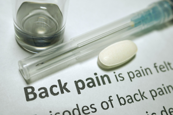 Graphic showing the words “back pain” with a pill and needle nearby