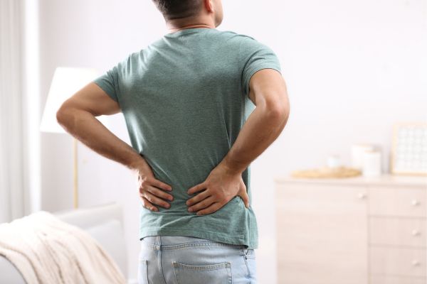 Man holding his lower back in pain