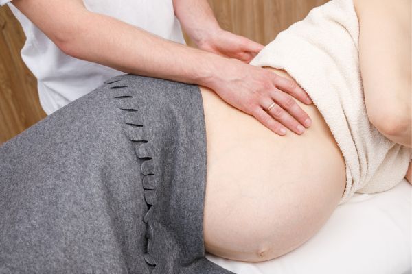 Prenatal chiropractor treating a pregnant woman
