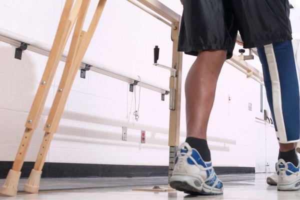Patient on crutches works to improve balance
