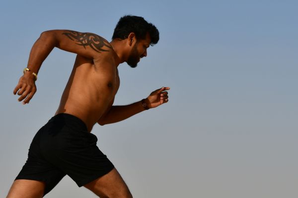 Physically fit man running
