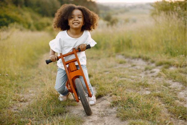 Healthy child rides their bike