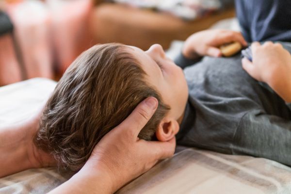 Child receives gentle chiropractic adjustment