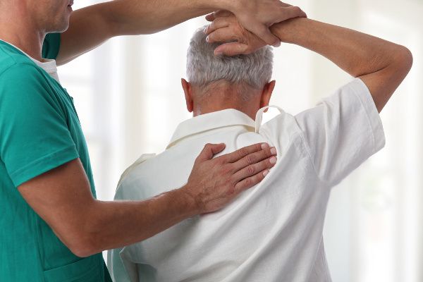 Image of chiropractor performing a procedure on a patient