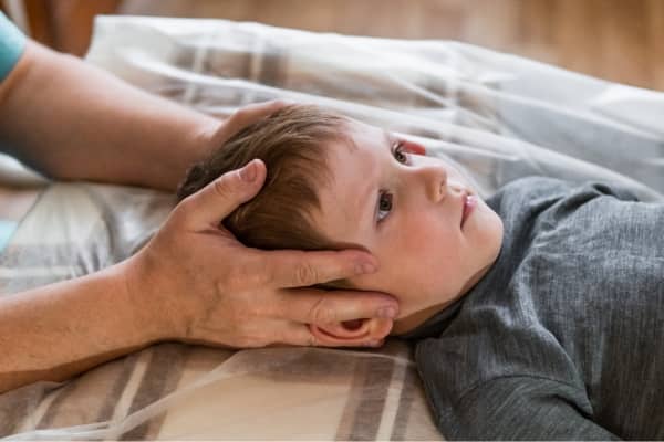 Young child undergoes pediatric chiropractic services