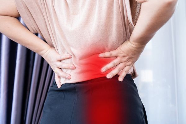 Woman with red illustration where sciatica pain is